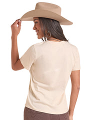 A woman shown from the back wearing a light beige short-sleeve t-shirt, a tan cowboy hat, and brown pants, against a plain white background. If you need any assistance with this item or the purchase of this item please call us at five six one seven four eight eight eight zero one Monday through Saturday 10:00a.m EST to 8:00 p.m EST