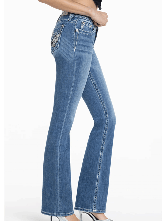 Miss Me M3080B73L Womens Angelica Mid Rise Slim Fit Bootcut Jean Medium Blue side view.If you need any assistance with this item or the purchase of this item please call us at five six one seven four eight eight eight zero one Monday through Saturday 10:00a.m EST to 8:00 p.m EST
