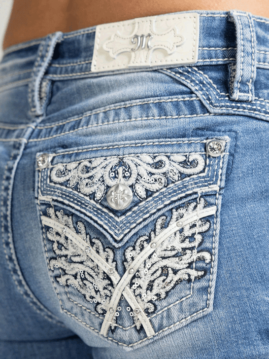 Miss Me M3444B157V Womens Mid Rise Slim Fit Bootcut Jean Medium Blue back close up. If you need any assistance with this item or the purchase of this item please call us at five six one seven four eight eight eight zero one Monday through Saturday 10:00a.m EST to 8:00 p.m EST