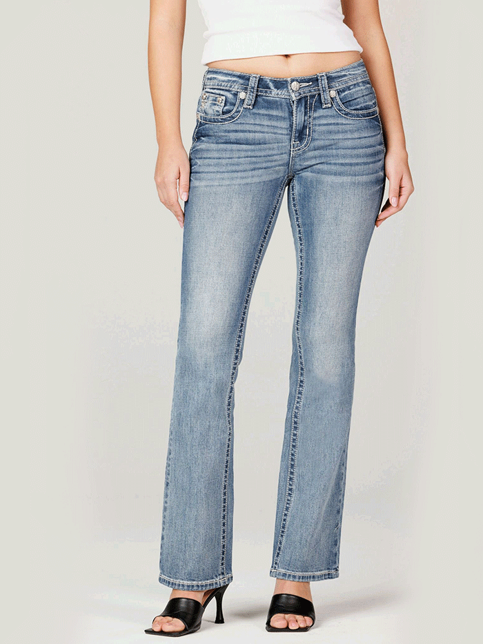 Miss Me M9481BV Womens Mid Rise Slim Fit Bootcut Jean Medium Blue back close up. If you need any assistance with this item or the purchase of this item please call us at five six one seven four eight eight eight zero one Monday through Saturday 10:00a.m EST to 8:00 p.m EST