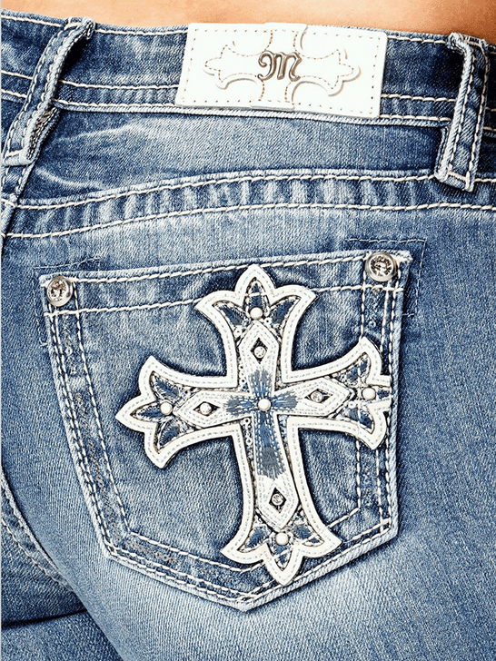 Miss Me M9481BV Womens Mid Rise Slim Fit Bootcut Jean Medium Blue back close up. If you need any assistance with this item or the purchase of this item please call us at five six one seven four eight eight eight zero one Monday through Saturday 10:00a.m EST to 8:00 p.m EST