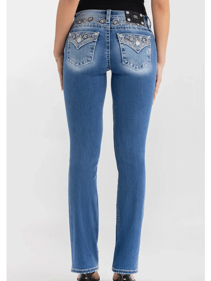 Miss Me M9498BL Womens Solene Fleur Mid Rise Bootcut Jean Medium Blue back close up view. If you need any assistance with this item or the purchase of this item please call us at five six one seven four eight eight eight zero one Monday through Saturday 10:00a.m EST to 8:00 p.m EST
