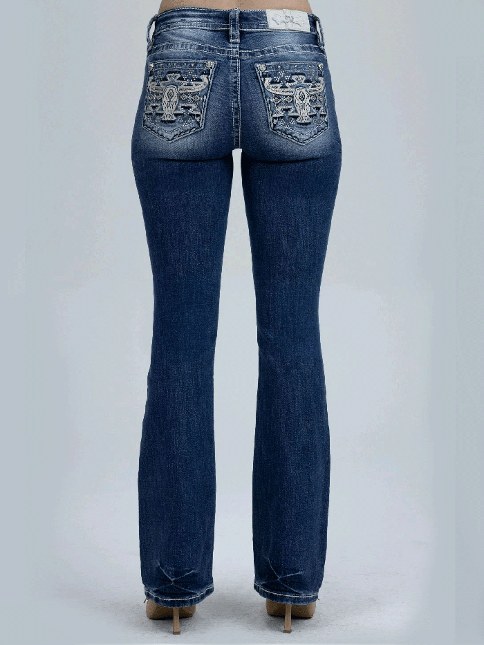Miss Me M9600BV Womens Mid Rise Slim Fit Bootcut Jean Medium Blue back close up. If you need any assistance with this item or the purchase of this item please call us at five six one seven four eight eight eight zero one Monday through Saturday 10:00a.m EST to 8:00 p.m EST