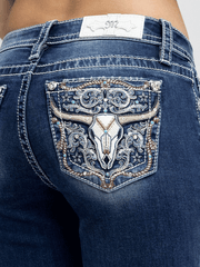 Miss Me M9610B Womens Mid Rise Bootcut Jean Dark Wash close up. If you need any assistance with this item or the purchase of this item please call us at five six one seven four eight eight eight zero one Monday through Saturday 10:00a.m EST to 8:00 p.m EST