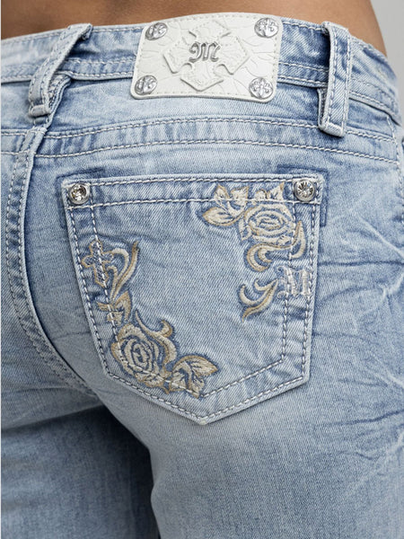 Miss Me M9622B Womens Embroidered Mid Rise Bootcut Jean Light Blue back close up. If you need any assistance with this item or the purchase of this item please call us at five six one seven four eight eight eight zero one Monday through Saturday 10:00a.m EST to 8:00 p.m EST