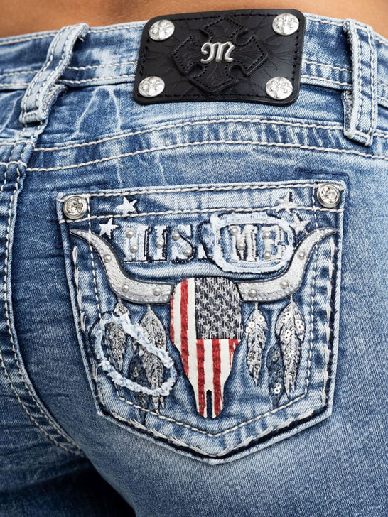 Miss Me M9624B Womens Mid Rise Bootcut Jeans Medium Blue close up. If you need any assistance with this item or the purchase of this item please call us at five six one seven four eight eight eight zero one Monday through Saturday 10:00a.m EST to 8:00 p.m EST