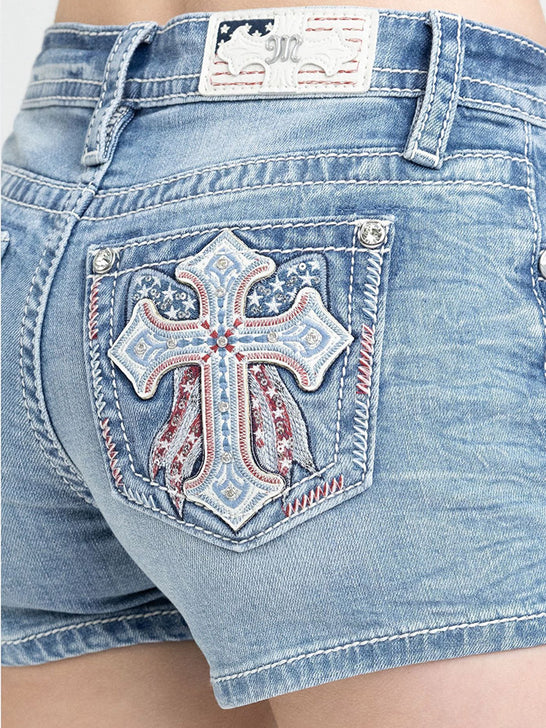 Miss Me M9661H Womens Mid Raise Denim Shorts Light Wash close up. If you need any assistance with this item or the purchase of this item please call us at five six one seven four eight eight eight zero one Monday through Saturday 10:00a.m EST to 8:00 p.m EST