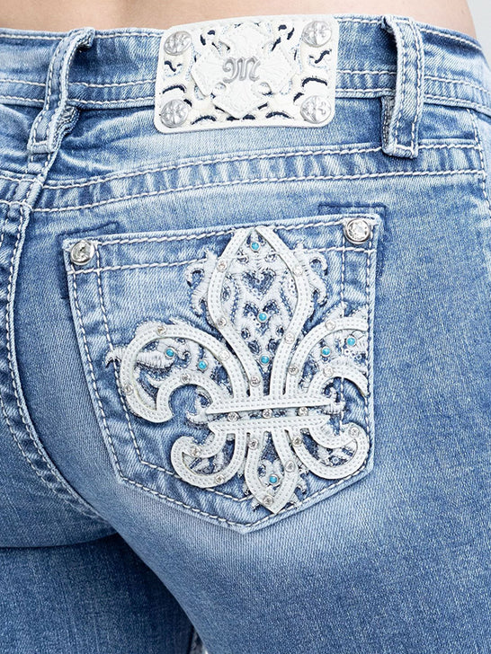 Miss Me M9684B Womens Mid Rise Bootcut Jeans Medium Blue close up. If you need any assistance with this item or the purchase of this item please call us at five six one seven four eight eight eight zero one Monday through Saturday 10:00a.m EST to 8:00 p.m EST