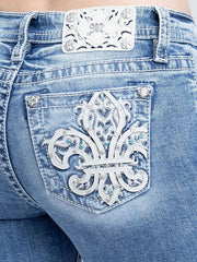 Miss Me M9684B Womens Mid Rise Bootcut Jeans Medium Blue close up. If you need any assistance with this item or the purchase of this item please call us at five six one seven four eight eight eight zero one Monday through Saturday 10:00a.m EST to 8:00 p.m EST