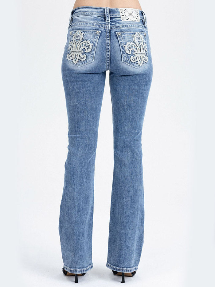 Miss Me M9684B Womens Mid Rise Bootcut Jeans Medium Blue close up. If you need any assistance with this item or the purchase of this item please call us at five six one seven four eight eight eight zero one Monday through Saturday 10:00a.m EST to 8:00 p.m EST