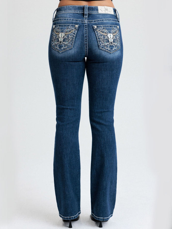 Miss Me M9707BL Womens Mid Rise Bootcut Jean Dark Blue back close up. If you need any assistance with this item or the purchase of this item please call us at five six one seven four eight eight eight zero one Monday through Saturday 10:00a.m EST to 8:00 p.m EST
