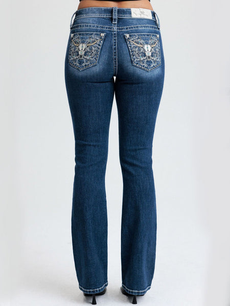 Miss Me M9707BL Womens Mid Rise Bootcut Jean Dark Blue back view. If you need any assistance with this item or the purchase of this item please call us at five six one seven four eight eight eight zero one Monday through Saturday 10:00a.m EST to 8:00 p.m EST