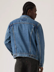 A person shown from the back wearing a cropped blue denim jacket and dark jeans against a plain light background. If you need any assistance with this item or the purchase of this item please call us at five six one seven four eight eight eight zero one Monday through Saturday 10:00a.m EST to 8:00 p.m EST