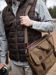 Local Boy Outfitters L2200004-LTR Messenger Bag Leather hanging view. If you need any assistance with this item or the purchase of this item please call us at five six one seven four eight eight eight zero one Monday through Saturday 10:00a.m EST to 8:00 p.m EST