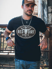 Red Dirt RDHC-T-195 Mens Steer Clear Tee Black front view on model. If you need any assistance with this item or the purchase of this item please call us at five six one seven four eight eight eight zero one Monday through Saturday 10:00a.m EST to 8:00 p.m EST