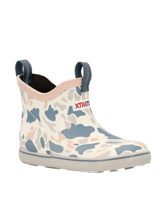 A single Xtravagant rubber rain boot featuring a blue, pink, and beige camouflage pattern, with a light pink collar, dark blue pull tabs, and a light gray sole. If you need any assistance with this item or the purchase of this item please call us at five six one seven four eight eight eight zero one Monday through Saturday 10:00a.m EST to 8:00 p.m EST