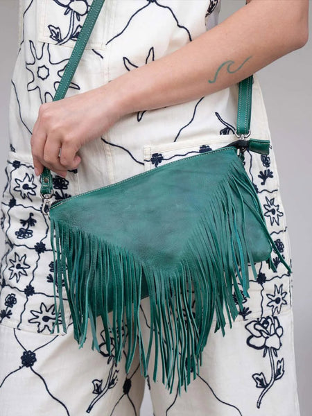 Bed Stu A694264-ATTLDD-X Womens Silverrock Crossbody Handbag Arctic Teal front view on model. If you need any assistance with this item or the purchase of this item please call us at five six one seven four eight eight eight zero one Monday through Saturday 10:00a.m EST to 8:00 p.m EST
