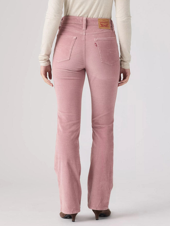 A model wearing a pair of dusty rose pink corduroy pants, styled with a cream long-sleeve top and brown suede boots, photographed against a light gray studio background. If you need any assistance with this item or the purchase of this item please call us at five six one seven four eight eight eight zero one Monday through Saturday 10:00a.m EST to 8:00 p.m EST