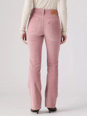 A person shown from the back wearing pink corduroy jeans with a cream long-sleeve top and dark brown heels, photographed against a light gray studio background. If you need any assistance with this item or the purchase of this item please call us at five six one seven four eight eight eight zero one Monday through Saturday 10:00a.m EST to 8:00 p.m EST