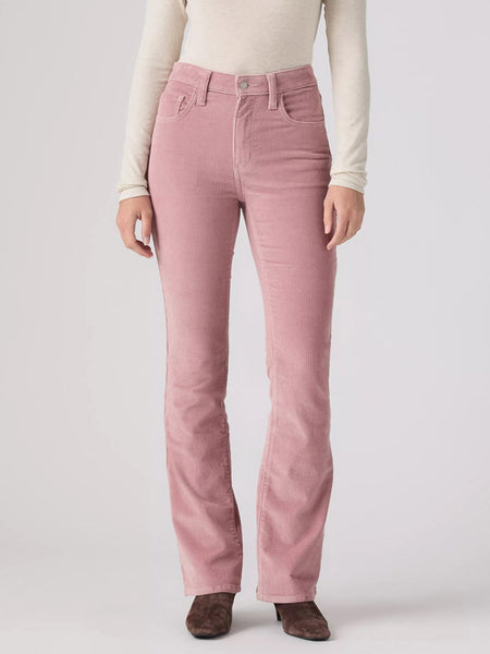 A model wearing a pair of dusty rose pink corduroy pants, styled with a cream long-sleeve top and brown suede boots, photographed against a light gray studio background. If you need any assistance with this item or the purchase of this item please call us at five six one seven four eight eight eight zero one Monday through Saturday 10:00a.m EST to 8:00 p.m EST