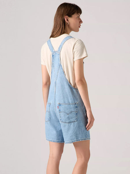 Levi's 523330059 Womens Vintage Shortalls Light Blue back view on model. If you need any assistance with this item or the purchase of this item please call us at five six one seven four eight eight eight zero one Monday through Saturday 10:00a.m EST to 8:00 p.m EST
