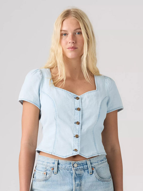 Levi's 007WW0001 Womens Miette Short Sleeve Top Light Blue front view on model. If you need any assistance with this item or the purchase of this item please call us at five six one seven four eight eight eight zero one Monday through Saturday 10:00a.m EST to 8:00 p.m EST
