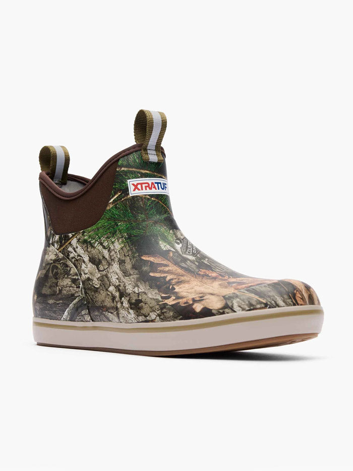 Xtratuf XMABMDNA Mens Ankle Deck Boot Mossy Oak Country DNA side / front view. If you need any assistance with this item or the purchase of this item please call us at five six one seven four eight eight eight zero one Monday through Saturday 10:00a.m EST to 8:00 p.m EST