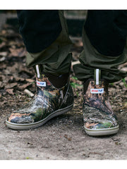 Xtratuf XMABMDNA Mens Ankle Deck Boot Mossy Oak Country DNA outdoors view. If you need any assistance with this item or the purchase of this item please call us at five six one seven four eight eight eight zero one Monday through Saturday 10:00a.m EST to 8:00 p.m EST