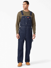 Dickies 83294NB Mens Indigo Bib Overalls Navy Blue front view regular. If you need any assistance with this item or the purchase of this item please call us at five six one seven four eight eight eight zero one Monday through Saturday 10:00a.m EST to 8:00 p.m EST