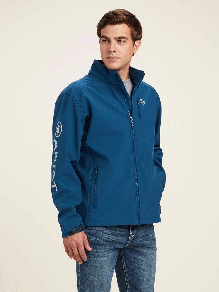 Ariat 10041611 Mens Logo 2.0 Softshell Jacket Majolica Blue front and side view. If you need any assistance with this item or the purchase of this item please call us at five six one seven four eight eight eight zero one Monday through Saturday 10:00a.m EST to 8:00 p.m EST