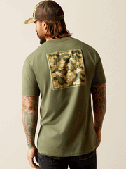 Ariat 10052574 Mens Duck T-Shirt Surplus Green back view. If you need any assistance with this item or the purchase of this item please call us at five six one seven four eight eight eight zero one Monday through Saturday 10:00a.m EST to 8:00 p.m EST