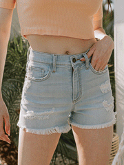 Sneak Peek SP-S7393ML Womens Frayed Hem High Rise Denim Shorts Light Blue front view on model outdoors. If you need any assistance with this item or the purchase of this item please call us at five six one seven four eight eight eight zero one Monday through Saturday 10:00a.m EST to 8:00 p.m EST