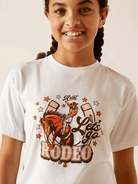 Ariat 10047908 Kids Let's Rodeo T-Shirt White close up of front view. If you need any assistance with this item or the purchase of this item please call us at five six one seven four eight eight eight zero one Monday through Saturday 10:00a.m EST to 8:00 p.m EST