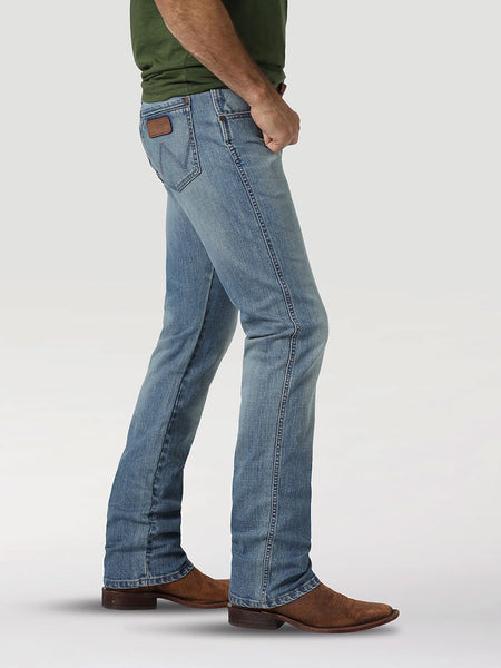 Wrangler 88MWZJK Mens Retro Slim Straight Jean Jacksboro side view. If you need any assistance with this item or the purchase of this item please call us at five six one seven four eight eight eight zero one Monday through Saturday 10:00a.m EST to 8:00 p.m EST