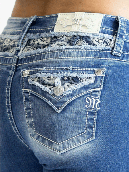 Miss Me M9368BV Womens Mid Rise Boot Jean Medium Blue back pocket close up. If you need any assistance with this item or the purchase of this item please call us at five six one seven four eight eight eight zero one Monday through Saturday 10:00a.m EST to 8:00 p.m EST

