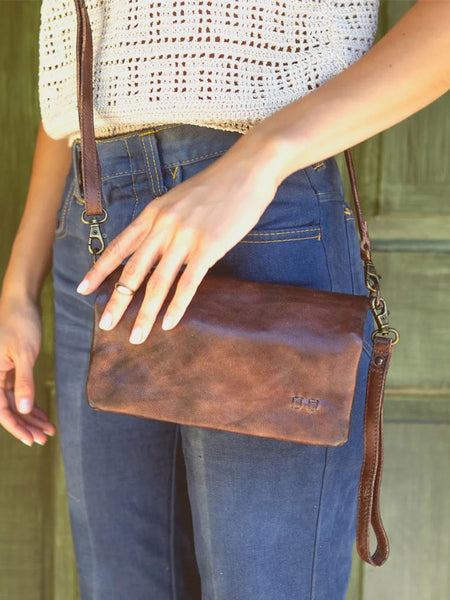 Bed Stu A621040-TKRS-X Womens Cadence 3 In 1 Handbag Teak Rustic front view on model. If you need any assistance with this item or the purchase of this item please call us at five six one seven four eight eight eight zero one Monday through Saturday 10:00a.m EST to 8:00 p.m EST

