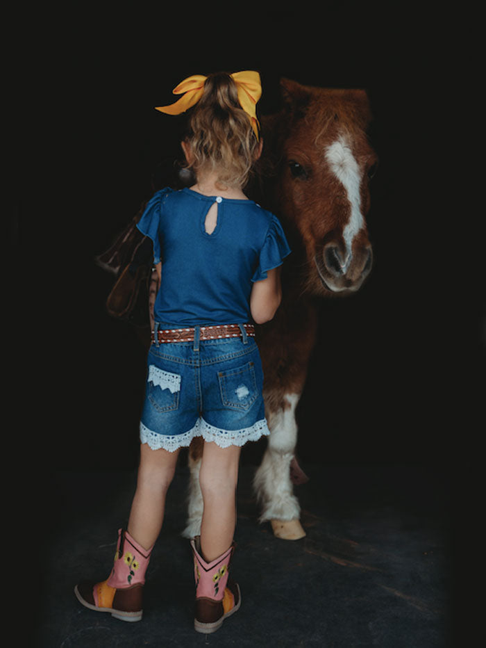 Shea Baby SBD02 Kids Denim Lace Shorts Blue front view on model. If you need any assistance with this item or the purchase of this item please call us at five six one seven four eight eight eight zero one Monday through Saturday 10:00a.m EST to 8:00 p.m EST