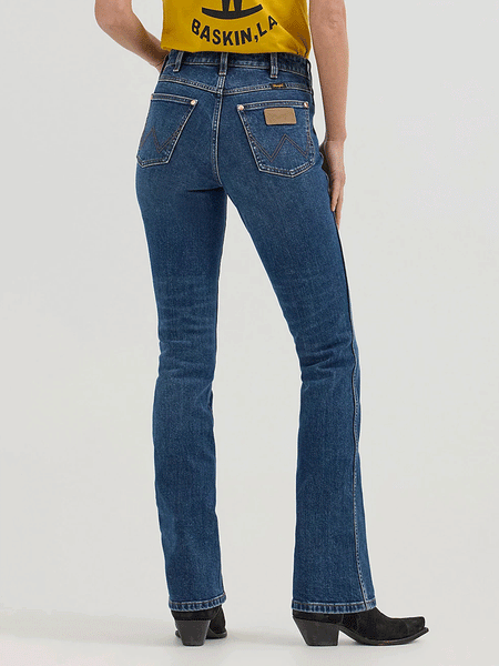 Wrangler 112360614 Womens X Lainey Wilson Boot Hugger Jeans Baskin Blue Wash back. If you need any assistance with this item or the purchase of this item please call us at five six one seven four eight eight eight zero one Monday through Saturday 10:00a.m EST to 8:00 p.m EST