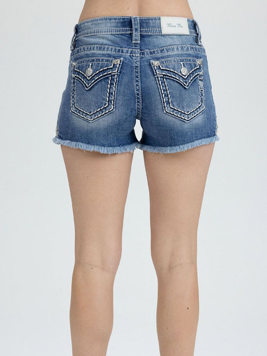 Miss Me M9660H Womens Mid-Rise Short Medium Wash Blue back view. If you need any assistance with this item or the purchase of this item please call us at five six one seven four eight eight eight zero one Monday through Saturday 10:00a.m EST to 8:00 p.m EST