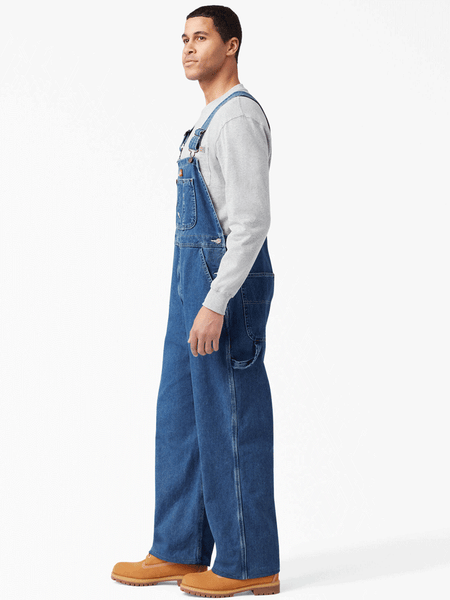 Dickies 8396SNB Mens Bib Overall Indigo Stone Washed side view regular. If you need any assistance with this item or the purchase of this item please call us at five six one seven four eight eight eight zero one Monday through Saturday 10:00a.m EST to 8:00 p.m EST