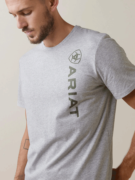 Ariat 10043371 Mens Vertical Logo T-Shirt Heather Grey front close up view. If you need any assistance with this item or the purchase of this item please call us at five six one seven four eight eight eight zero one Monday through Saturday 10:00a.m EST to 8:00 p.m EST