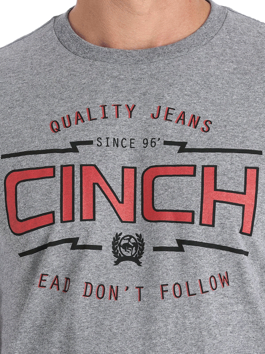 Cinch MTT1690377 Mens Classic Logo Tee Carbon close up view of graphic. If you need any assistance with this item or the purchase of this item please call us at five six one seven four eight eight eight zero one Monday through Saturday 10:00a.m EST to 8:00 p.m EST