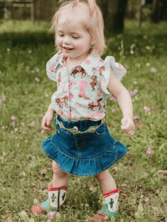 Shea Baby SBD01 Kids Ruffle Denim Skirt Blue front view on toddler