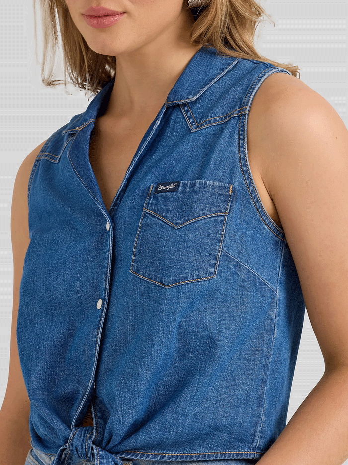 Wrangler 112360785 Womens Sleeveless Tie Front Shirt Mid Wash Denim front view. If you need any assistance with this item or the purchase of this item please call us at five six one seven four eight eight eight zero one Monday through Saturday 10:00a.m EST to 8:00 p.m EST

