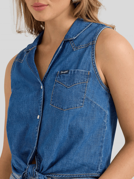 Wrangler 112360785 Womens Sleeveless Tie Front Shirt Mid Wash Denim front close up view. If you need any assistance with this item or the purchase of this item please call us at five six one seven four eight eight eight zero one Monday through Saturday 10:00a.m EST to 8:00 p.m EST

