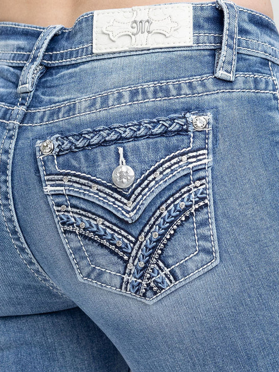 Miss Me M3444B171 Womens Mid Rise Boot Jean Medium Blue close up. If you need any assistance with this item or the purchase of this item please call us at five six one seven four eight eight eight zero one Monday through Saturday 10:00a.m EST to 8:00 p.m EST