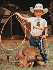 Shea Baby BVINB08 Kids Lifes Better On A Horse Shirt Beige front view on model. If you need any assistance with this item or the purchase of this item please call us at five six one seven four eight eight eight zero one Monday through Saturday 10:00a.m EST to 8:00 p.m EST