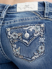 Miss Me M9681B Womens Mid Rise Bootcut Jeans Medium Blue back close up.  If you need any assistance with this item or the purchase of this item please call us at five six one seven four eight eight eight zero one Monday through Saturday 10:00a.m EST to 8:00 p.m EST