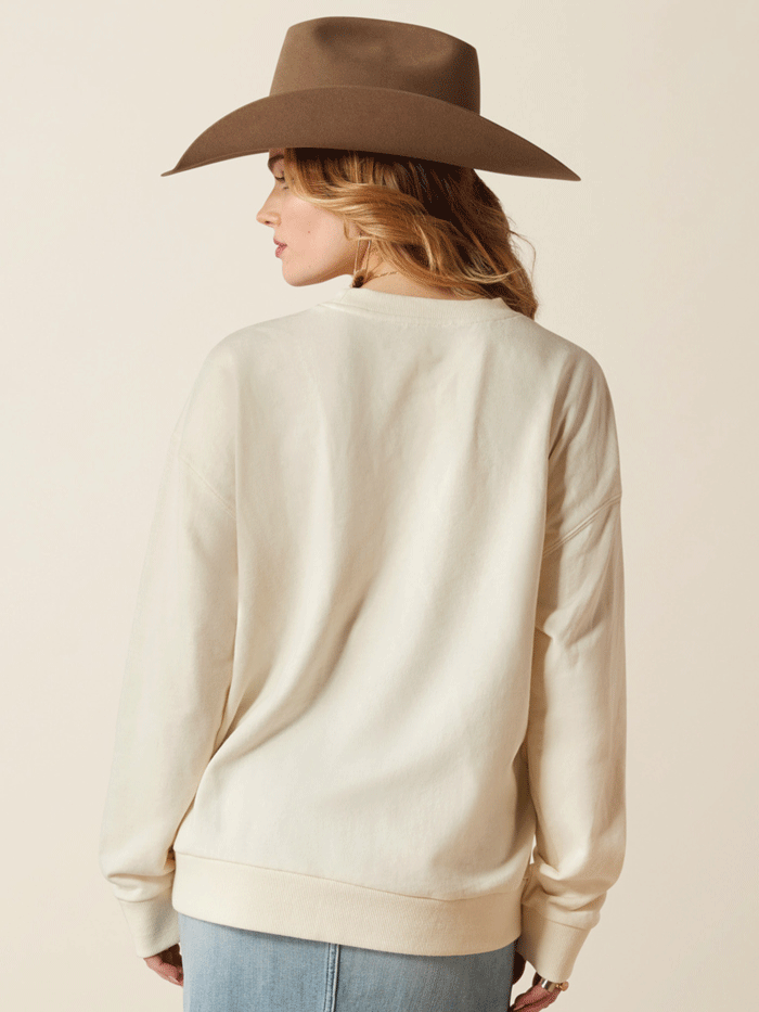 Ariat 10053961 Womens Moonstone Sweatshirt Whisper White front. If you need any assistance with this item or the purchase of this item please call us at five six one seven four eight eight eight zero one Monday through Saturday 10:00a.m EST to 8:00 p.m EST