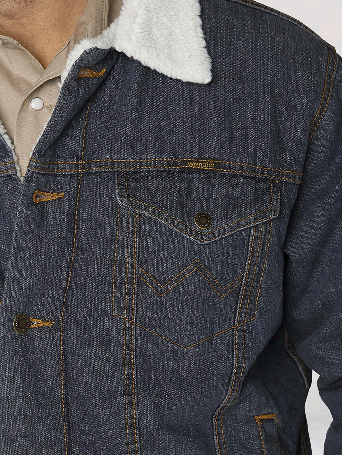 Wrangler 74256RT Mens Western Sherpa Lined Denim Trucker Jacket Rustic front view on model. If you need any assistance with this item or the purchase of this item please call us at five six one seven four eight eight eight zero one Monday through Saturday 10:00a.m EST to 8:00 p.m EST